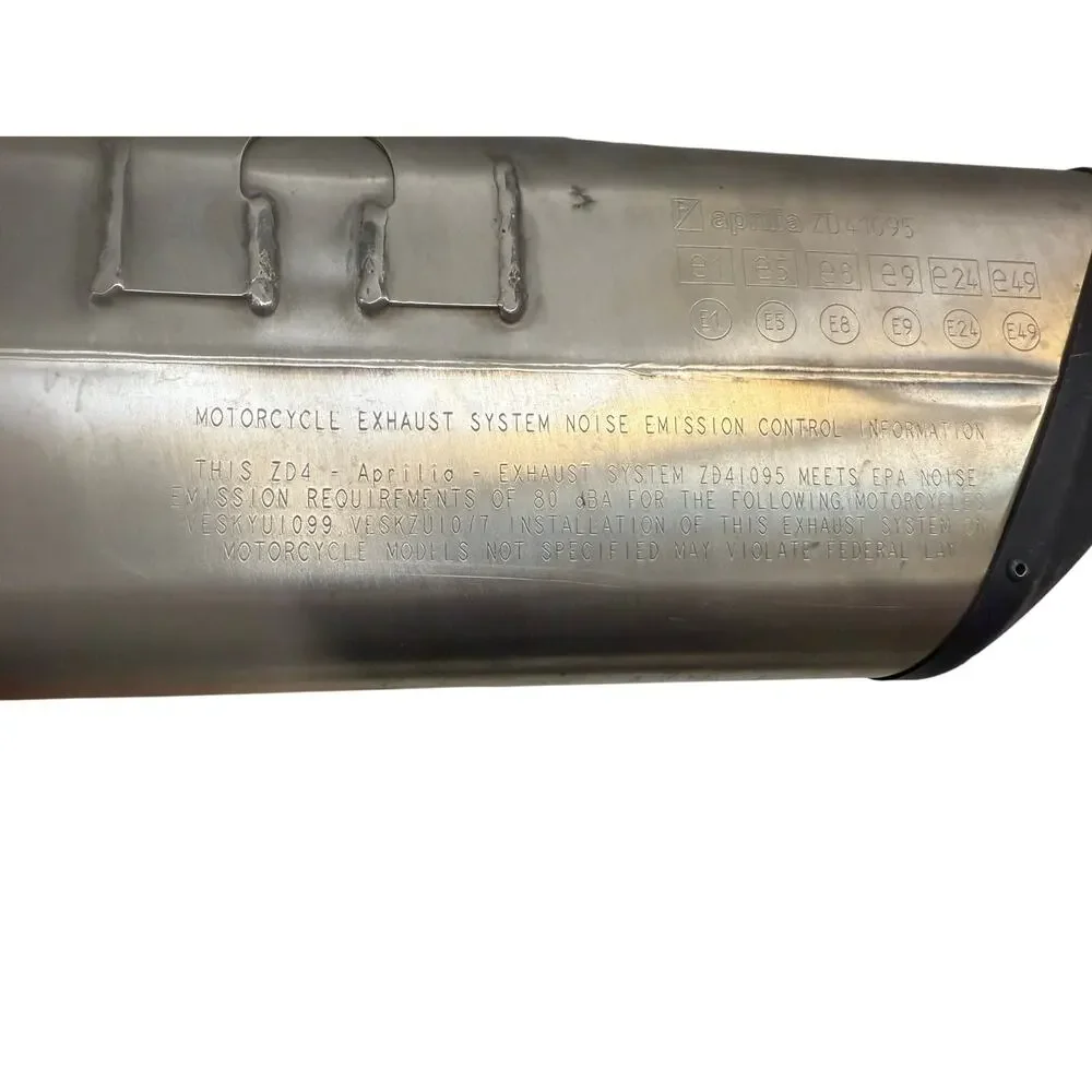 . motorcycle exhaust system, specifically an SC-Project exhaust for an Aprilia